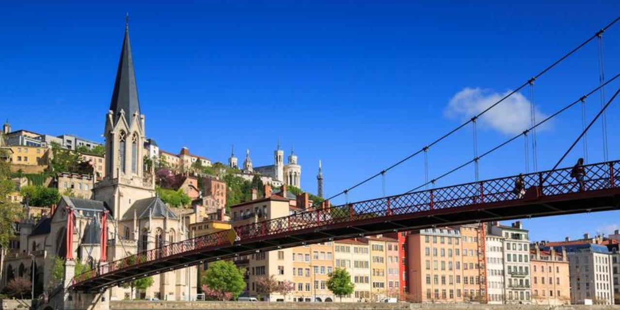 A photo of Lyon, France showing buildings and a bridge