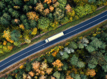 A truck on a winding highway 