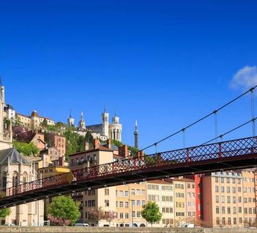 A photo of Lyon, France showing buildings and a bridge